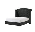 Black king bed with tufted headboard and nailhead trim
