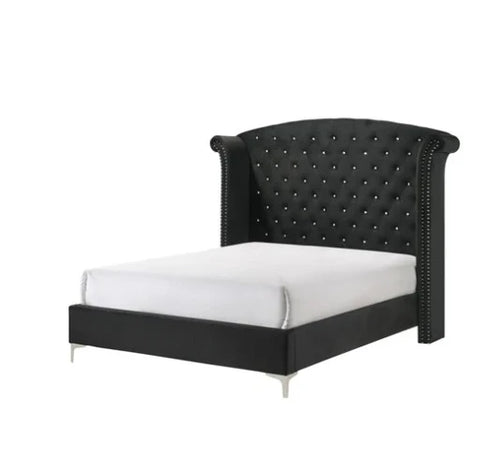 Black king bed with tufted headboard and nailhead trim